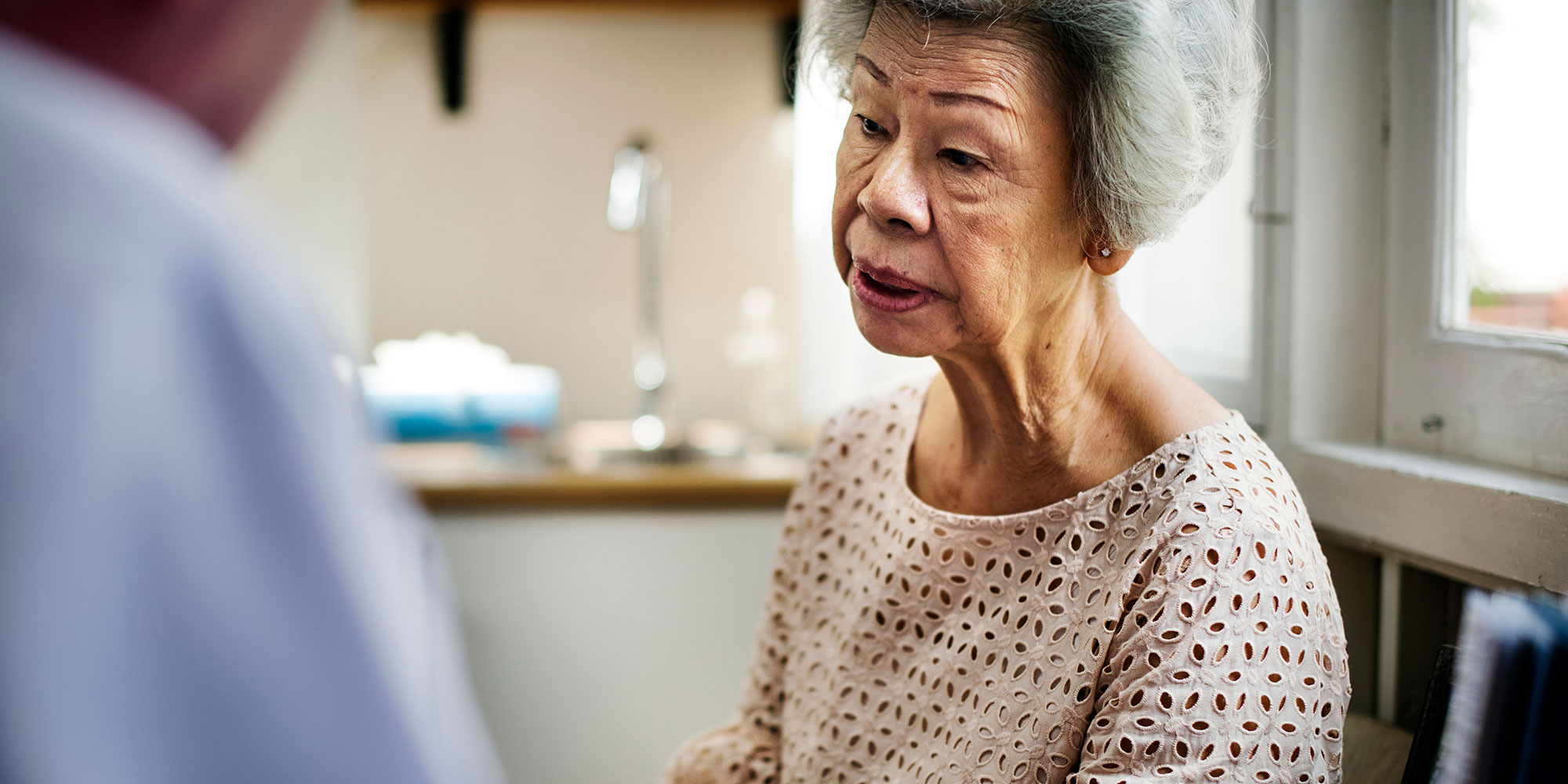 Elderly woman talking to case manager