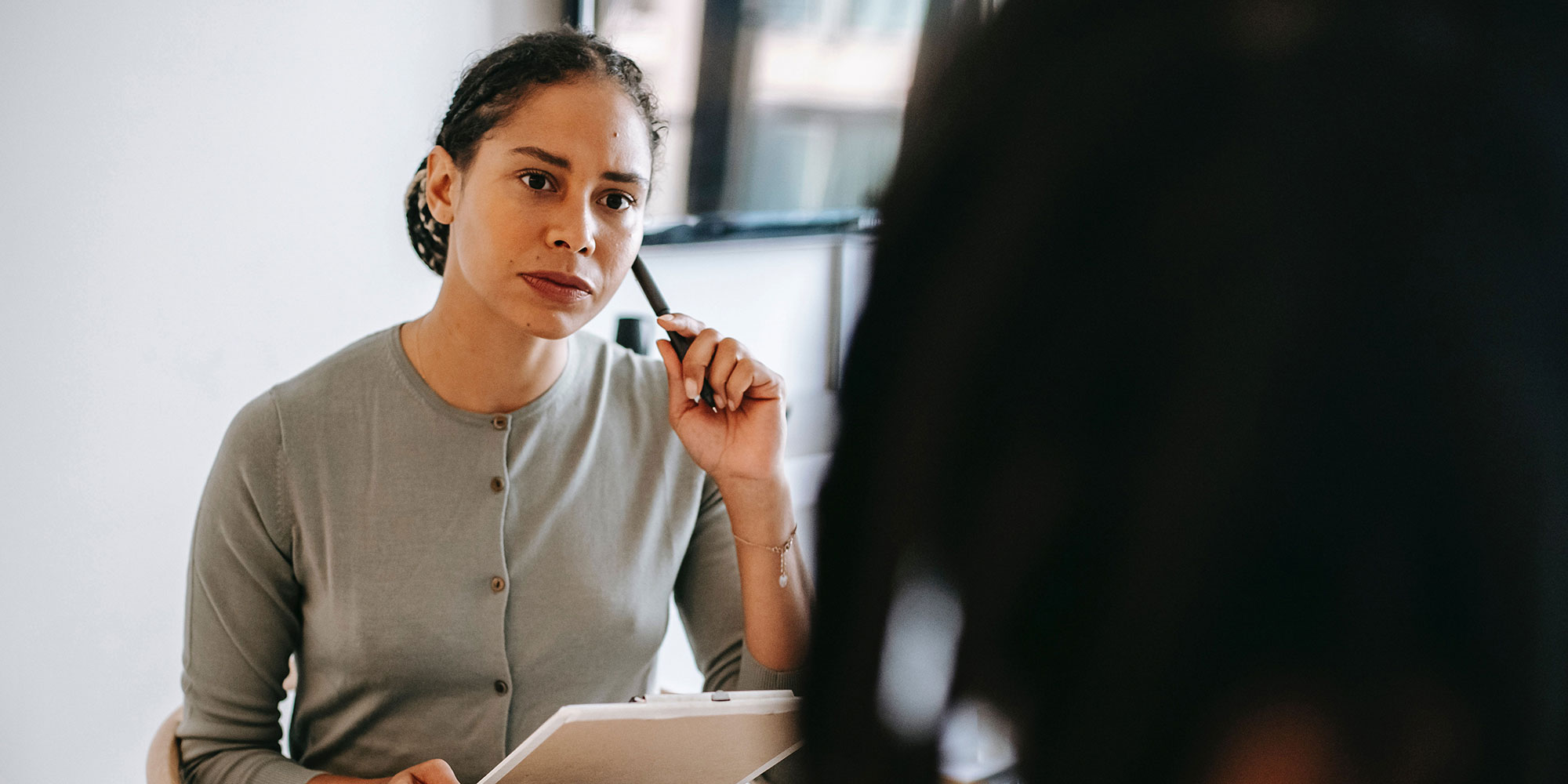 Case manager with headset and clipboard