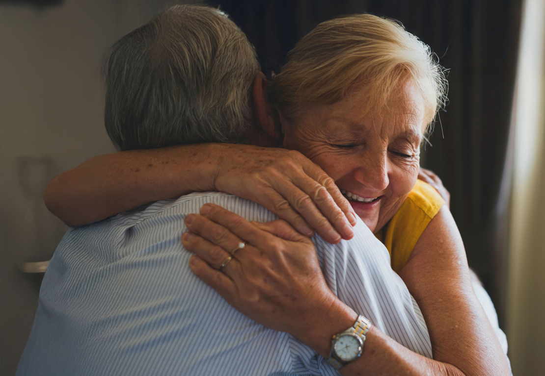 Woman hugging man
